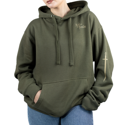 Person wearing a green hoodie with a cross design on a white background